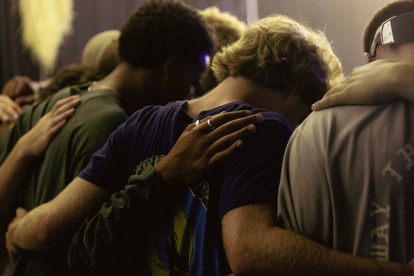 Youth gathered in prayer and support during ministry